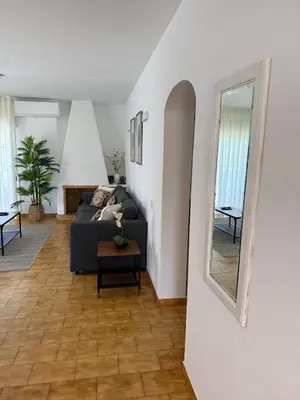 a living room with a couch and a table at COZY APARTMENT OURA BEACH in Albufeira