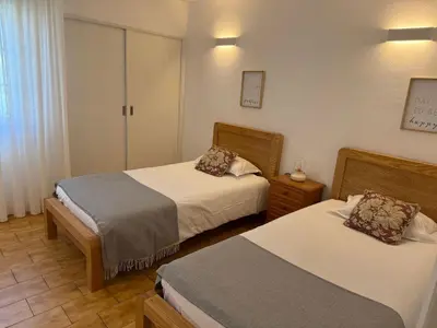 a hotel room with two beds at COZY APARTMENT OURA BEACH in Albufeira