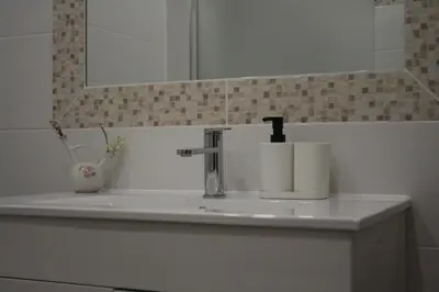 a bathroom sink with two rolls of toilet paper on it at Albufeira Beach - Tranquilidade junto à praia e ao centro! in Albufeira