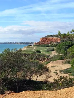 a view of a golf course with the ocean at PARADISE ON THE BEACH in Albufeira