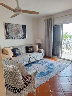 a living room with a couch and a table at Piece of Paradise @ Balaia Golf Village, Albufeira, PORTUGAL - 4 STAR in Albufeira
