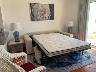 a room with a bed in the corner of a room at Piece of Paradise @ Balaia Golf Village, Albufeira, PORTUGAL - 4 STAR in Albufeira