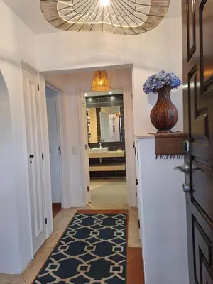 a hallway with a bathroom with a sink and a vase at Piece of Paradise @ Balaia Golf Village, Albufeira, PORTUGAL - 4 STAR in Albufeira