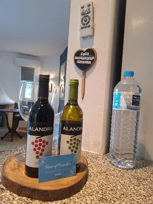 two bottles of wine on a table next to a water bottle at Piece of Paradise @ Balaia Golf Village, Albufeira, PORTUGAL - 4 STAR in Albufeira