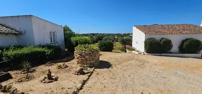 a yard with a house and a building at Quinta do Lagar - 10 in Albufeira