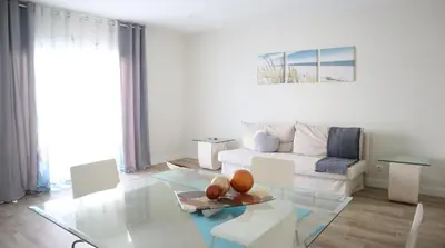 a living room with a couch and a table at MFA By Albufeira Rental in Albufeira