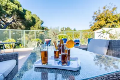 a tray of drinks sitting on a table at Villa Patio in Albufeira