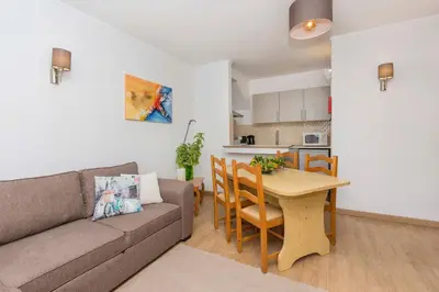 a living room with a couch and a table at Apartment Maresia in Albufeira