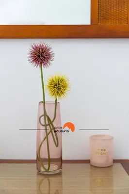 a vase with a flower in it on a table at #134 Vila Dias 2 by Home Holidays in Albufeira