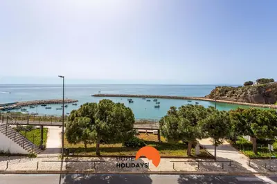 a view of the ocean from the balcony of a resort at #114 T2 Foxy H by Home Holidays in Albufeira