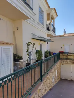 a balcony of a house with a fence at Candyland Apartment in Albufeira