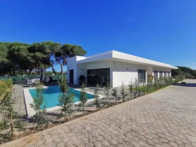 a villa with a swimming pool and a house at Valverde 2 Villa, Vilamoura, Algarve, only 5 minutes from Marina, Golf and Beach in Vilamoura