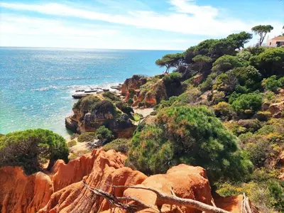 a view of a beach with rocks in the water at Luxury Condo in Top Complex with Ocean and Marina View by Be Cherish in Albufeira