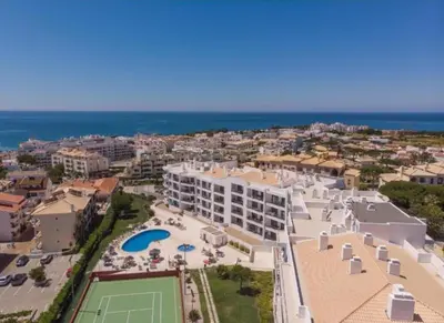 an aerial view of a resort with a tennis court at Vista das Ondas - Apartamento 204 in Albufeira