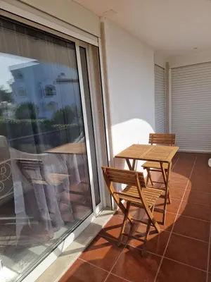 a table and two chairs on a balcony at Perfect location for nightlife @ the Strip in Albufeira