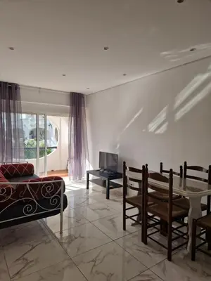 a living room with a couch and a table at Perfect location for nightlife @ the Strip in Albufeira