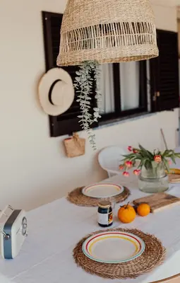 a living room with a couch and a tv at Casa Manjerico in Loulé