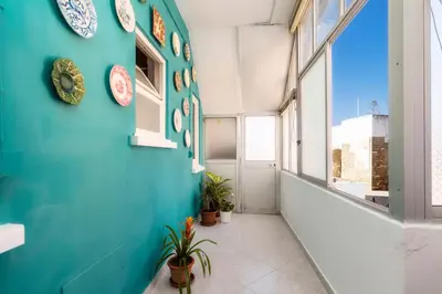 a hallway with plates on a blue wall at Happen!ng 2 in Faro