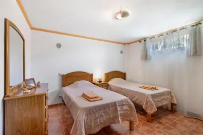 a living room with a couch and a table at Villa Trindade in Albufeira