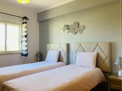 a bathroom with a toilet and a shower at Penthouse T2 pool Terrace time in Albufeira