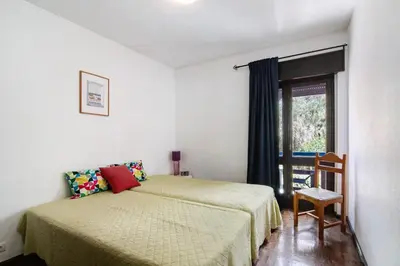 a bedroom with a bed and a window at Mar Azul 4 in Albufeira