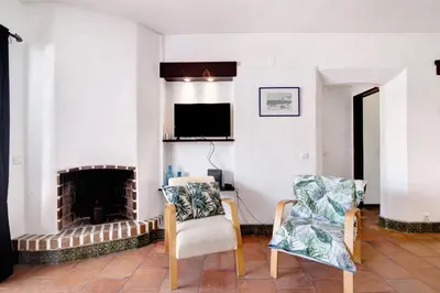 a living room with a couch and a table at Mar Azul 4 in Albufeira