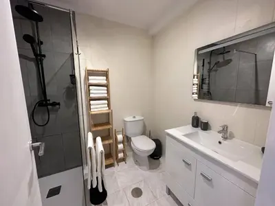 a bathroom with a toilet and a sink and a shower at Go4Portugal - Dinis - Luxe Condo with Pool, Airco, Seaview with two Balcony in Albufeira