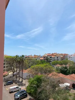 a view of a city with cars parked in a parking lot at House Т1 Bella Vista in Albufeira