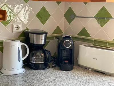 a coffeemaker and a coffee maker on a counter at Beach Villa Alfamar Praia da Falésia in Albufeira