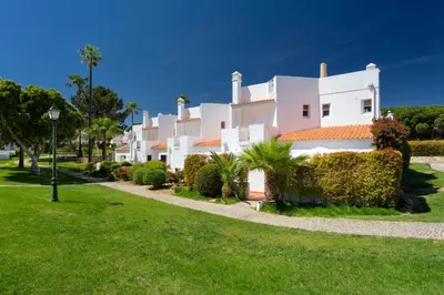 an aerial view of a white house with a swimming pool at Vila Senna in Vale do Lobo