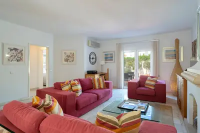 a view of the backyard of a white house at Vila Senna in Vale do Lobo