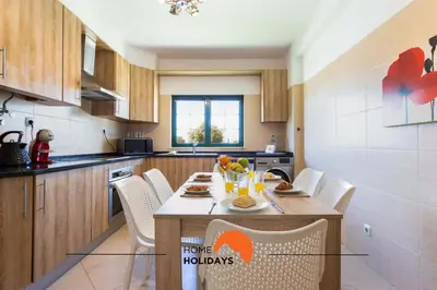 a kitchen with a table with fruits and drinks on it at #146 Summer House A6 by Home Holidays in Ferreiras