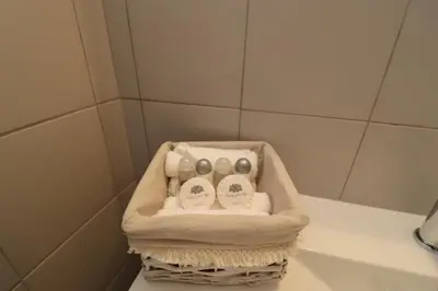 a basket of bathroom items sitting on a counter at São Rafael Beach Apartment 92A, Albufeira - Algarve in Albufeira
