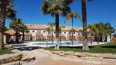 a resort with palm trees and a swimming pool at Villa Jardins 3 by Sunny Deluxe in Albufeira