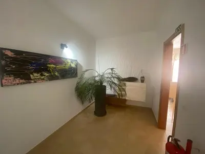 a room with a bed and a potted plant at Villa Jardins 3 by Sunny Deluxe in Albufeira