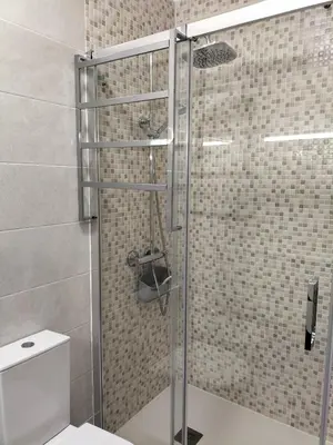 a shower with a glass door in a bathroom at T2 Vista Atlantica 3 minutos da praia de Quarteira in Quarteira