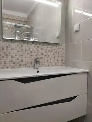 a white bathroom with a sink and a mirror at T2 Vista Atlantica 3 minutos da praia de Quarteira in Quarteira
