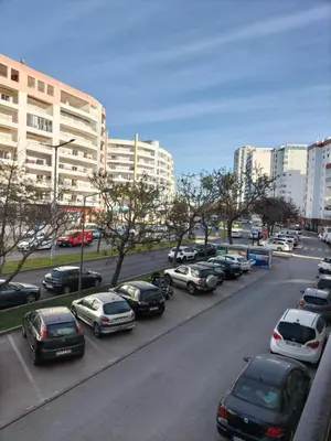 a bunch of cars parked on a city street at T2 Vista Atlantica 3 minutos da praia de Quarteira in Quarteira