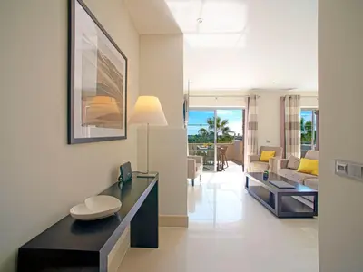 a living room with a table and a couch at Apartment Pine Hills Cristal by Interhome in Vilamoura