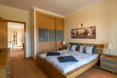 a bedroom with a large bed in a room at Villa Chris by Gabi Miguel in Albufeira