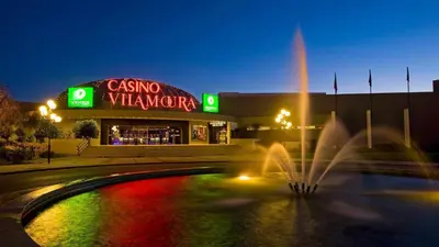 a building with a fountain in front of a store at Marina Vilamoura - Aquamar 009 - By Vilamoura Sun in Loulé