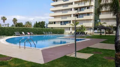 a swimming pool in front of a building at Marina Vilamoura - Aquamar 009 - By Vilamoura Sun in Loulé