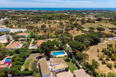 an aerial view of a house with a pool at Villa Bolota in Albufeira
