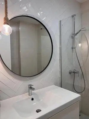 a white bathroom with a sink and a mirror at Vilamoura Neptuno Apartment in Vilamoura