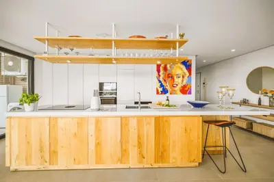 a kitchen with a wooden counter in a room at Luxury 3-Bed Penthouse with Ocean Views, Terrace & Pool in Quarteira