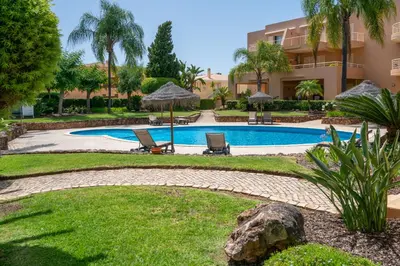 a resort with a swimming pool and a building at Coastal Greens by Seareen in Quarteira