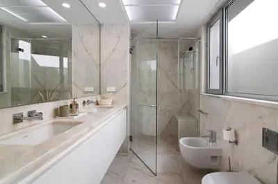 a white bedroom with a bed and a mirror at Sweet Home Albufeira in Albufeira