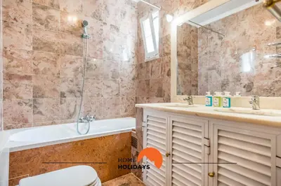 a bathroom with a tub and a toilet and a sink at #128 Number 10 Villa by Home Holidays in Albufeira