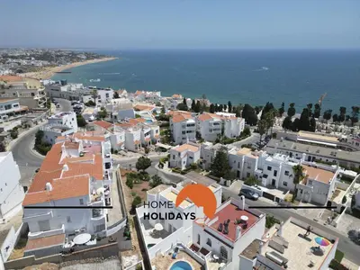an aerial view of a city with houses and the ocean at #128 Number 10 Villa by Home Holidays in Albufeira