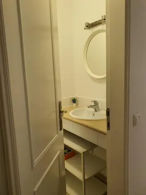 a bathroom with a sink and a mirror at Real Village in Quarteira